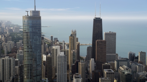 AX0001_053.0000021F - Aerial stock photo of John Hancock Center behind Trump International Hotel and Tower in Downtown Chicago, Illinois