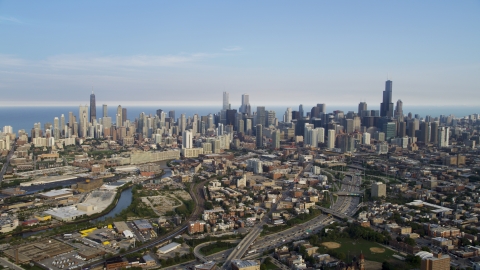 AX0001_063.0000122F - Aerial stock photo of The Downtown Chicago skyline seen from the west, on a hazy day, Illinois