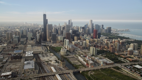 AX0001_077.0000231F - Aerial stock photo of The Chicago River near Willis Tower and the Downtown Chicago skyline, Illinois