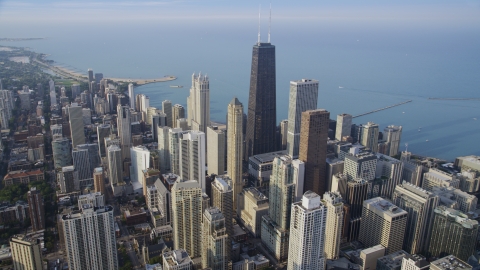 AX0001_085.0000037F - Aerial stock photo of Skyscrapers around the John Hancock Center by Lake Michigan, Downtown Chicago, Illinois