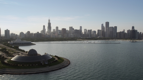 AX0001_100.0000050F - Aerial stock photo of The downtown skyline and harbor seen from Adler Planetarium, Downtown Chicago, Illinois