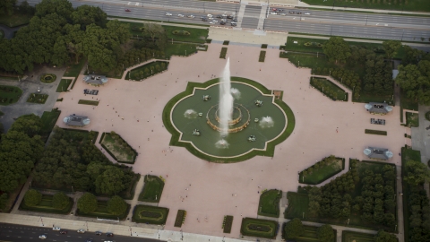 AX0001_150.0000223F - Aerial stock photo of A plume of water at Buckingham Fountain, Grant Park, Downtown Chicago, Illinois