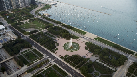 AX0001_151.0000000F - Aerial stock photo of The Buckingham Fountain in Grant Park near boats in the harbor, Downtown Chicago, Illinois