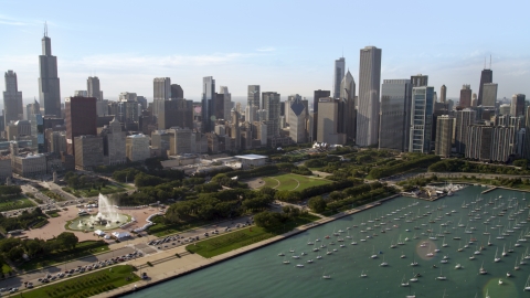 Grant Park and Downtown Chicago skyscrapers near boats in the harbor, Illinois Aerial Stock Photos | AX0002_005.0000214F