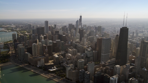 AX0002_017.0000173F - Aerial stock photo of John Hancock Center and a wide view of city skyscrapers in Downtown Chicago, Illinois