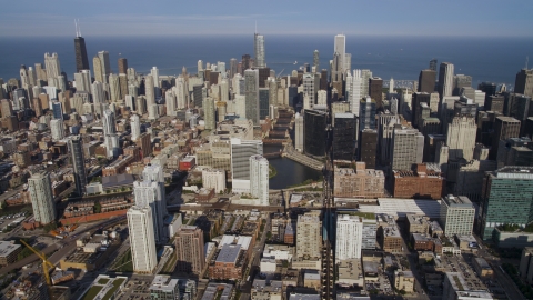 AX0002_036.0000315F - Aerial stock photo of A view from West Chicago at Downtown Chicago skyscrapers around the Chicago River, Illinois