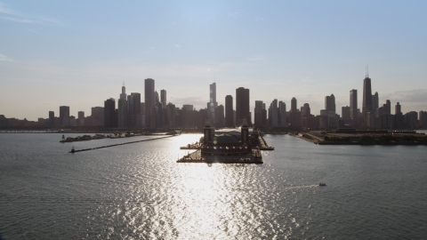 AX0002_046.0000122F - Aerial stock photo of Navy Pier and the Downtown Chicago skyline seen from Lake Michigan, Illinois