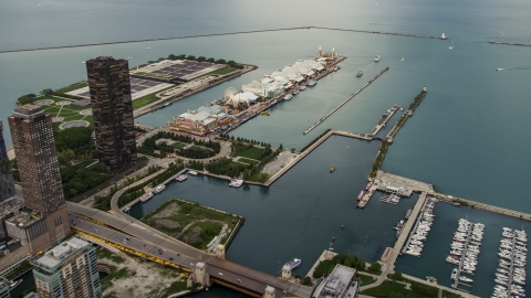 AX0003_061.0000464F - Aerial stock photo of Navy Pier and Lake Michigan at sunset in Downtown Chicago, Illinois