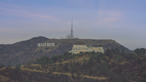 AX0158_008.0000386 - Aerial stock photo of Griffith Observatory and Hollywood Sign at twilight, Los Angeles, California