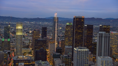 Wilshire Grand Center and nearby skyscrapers at twilight in Downtown Los Angeles, California Aerial Stock Photos | AX0158_047.0000110