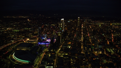 AX0158_083.0000000 - Aerial stock photo of The convention center, Staples Center, and skyscrapers at night, Downtown Los Angeles, California