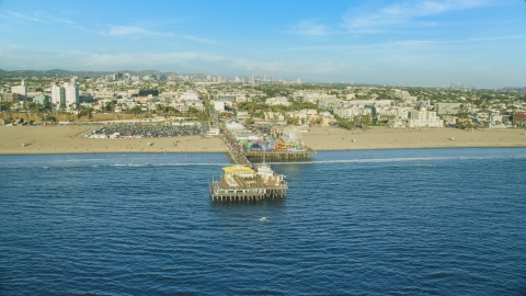 AX0161_079.0000129 - Aerial stock photo of Santa Monica Pier and beach seen from the ocean, Santa Monica, California