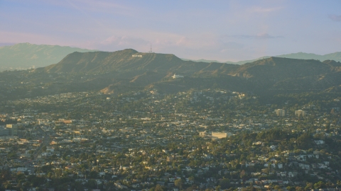 AX0162_043.0000126 - Aerial stock photo of Hollywood Sign and Griffith Observatory seen from Silver Lake, California