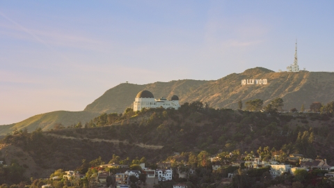 Griffith Observatory with the Hollywood Sign in the background in Los Angeles, California Aerial Stock Photos | AX0162_052.0000333