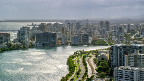 Waterfront apartment buildings and rain, San Juan, Puerto Rico Aerial Stock Photos | AX101_003.0000154F