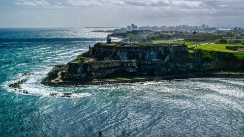 Historic fort on the coast with clear blue water, Old San Juan, Puerto Rico Aerial Stock Photos | AX101_015.0000000F