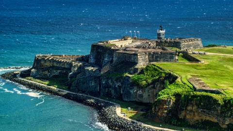 Historic fort overlooking the blue waters of the Caribbean, Old San Juan, Puerto Rico Aerial Stock Photos | AX101_017.0000000F