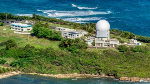 AX101_029.0000000F - Aerial stock photo of Punta Salinas Radar Site overlooking the blue waters of the Caribbean, Toa Baja, Puerto Rico