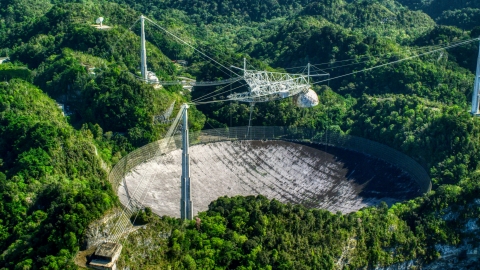 The Arecibo Observatory surrounded by trees, Puerto Rico Aerial Stock Photos | AX101_098.0000000F