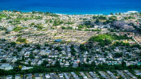 AX101_134.0000081F - Aerial stock photo of Coastal homes and apartment buildings in Arecibo, Puerto Rico 