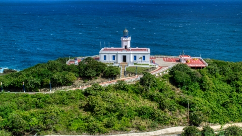 Arecibo Lighthouse beside the coastal waters of the Caribbean, Puerto Rico  Aerial Stock Photos | AX101_144.0000277F