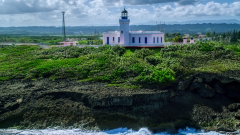 The Arecibo Lighthouse overlooking the island coast, Puerto Rico Aerial Stock Photos | AX101_148.0000244F