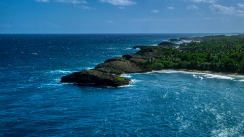 Rounded rock formations along the coast in Arecibo, Puerto Rico  Aerial Stock Photos | AX101_160.0000000F