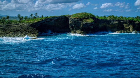 Coastal rock formation and crystal blue water, Arecibo, Puerto Rico  Aerial Stock Photos | AX101_165.0000000F