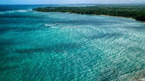 AX101_215.0000300F - Aerial stock photo of Private resort and beach across beautiful blue water of a bay, Dorado, Puerto Rico 