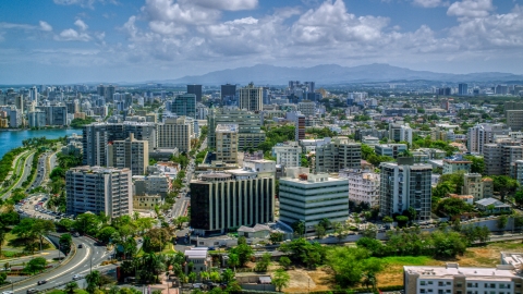 AX102_001.0000193F - Aerial stock photo of Apartment and office buildings near the water, San Juan, Puerto Rico