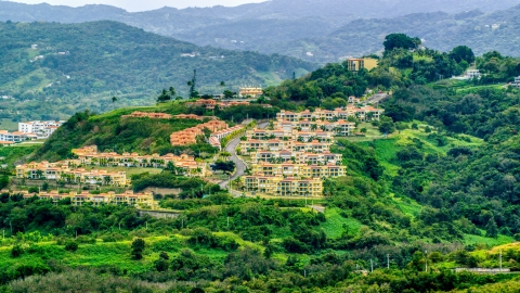 Condos on a tree covered hillside, Rio Grande, Puerto Rico  Aerial Stock Photos | AX102_044.0000000F