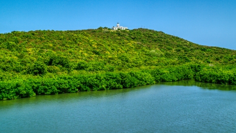 Cape San Juan Light, a hilltop lighthouse in Puerto Rico  Aerial Stock Photos | AX102_062.0000000F