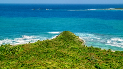 AX102_063.0000200F - Aerial stock photo of Tiny islands and blue ocean beyond the shore in Puerto Rico