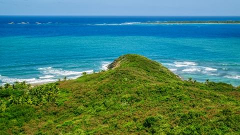 AX102_071.0000000F - Aerial stock photo of Green shore overlooking Caribbean ocean and tiny islands in Fajardo, Puerto Rico 