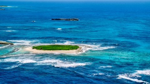 Tiny green island in tropical blue waters, Puerto Rico Aerial Stock Photos | AX102_086.0000000F