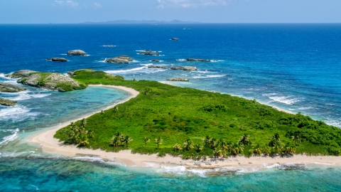 Tiny green island with beach in sapphire blue water, Puerto Rico  Aerial Stock Photos | AX102_089.0000033F