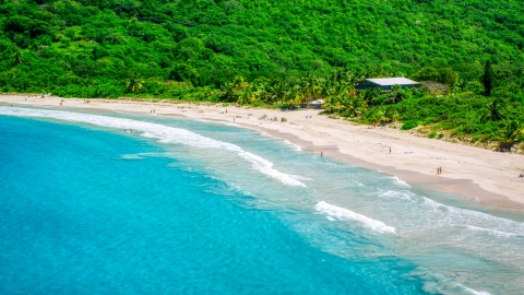 Sapphire blue waters by tourists on a white sand Caribbean beach, Culebra, Puerto Rico  Aerial Stock Photos | AX102_113.0000000F