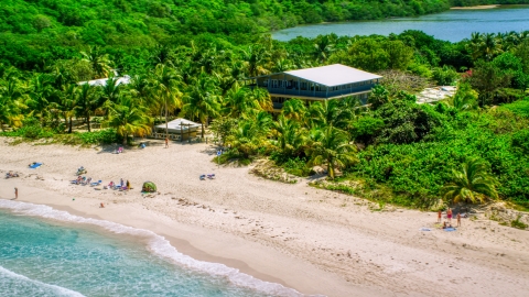 Tourists on a white sand Caribbean beach in Culebra, Puerto Rico  Aerial Stock Photos | AX102_113.0000233F