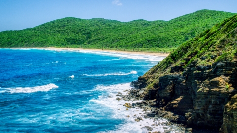 AX102_116.0000040F - Aerial stock photo of Sapphire blue waters and a Caribbean beach and lush vegetation, Culebra, Puerto Rico 