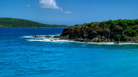 Sapphire blue waters and a rugged island coast in Culebra, Puerto Rico Aerial Stock Photos | AX102_126.0000000F