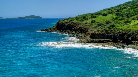 A rugged Caribbean island coast and blue water in Culebra, Puerto Rico  Aerial Stock Photos | AX102_128.0000342F