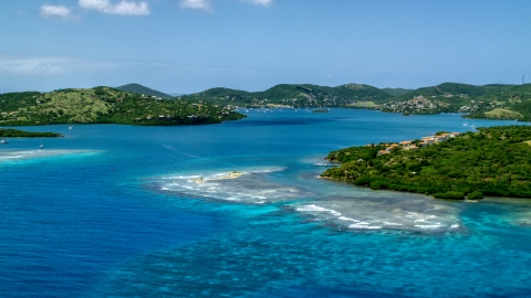 AX102_139.0000214F - Aerial stock photo of Small island town and a bay with tropical blue water in Culebra, Puerto Rico 