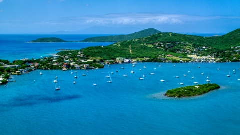 Sail boats in sapphire blue water near a small coastal town, Culebra, Puerto Rico  Aerial Stock Photos | AX102_142.0000000F