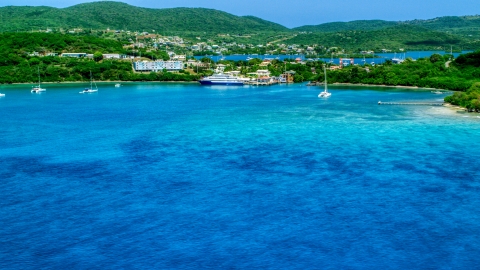 Ferry in the sapphire blue bay by a coastal town, Culebra, Puerto Rico  Aerial Stock Photos | AX102_148.0000000F