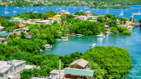 AX102_151.0000000F - Aerial stock photo of Boats in a cove at a small oceanside island town, Culebra, Puerto Rico 