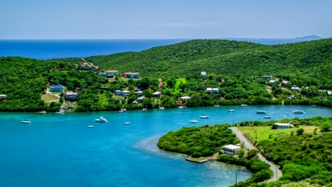 AX102_155.0000000F - Aerial stock photo of Oceanfront island homes overlooking sapphire waters, Culebra, Puerto Rico