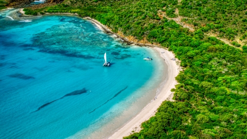 Boats beside a white sand beach on the Caribbean island of Culebrita, Puerto Rico  Aerial Stock Photos | AX102_180.0000000F