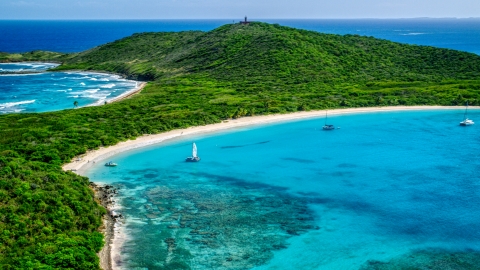 Catamarans in turquoise blue waters beside a white sand Caribbean beach, Culebrita, Puerto Rico  Aerial Stock Photos | AX102_182.0000000F