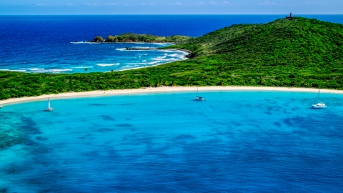 Catamarans in turquoise blue waters beside a white sand Caribbean beach, Culebrita, Puerto Rico  Aerial Stock Photos | AX102_182.0000258F