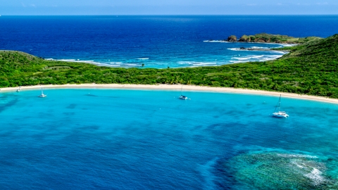 AX102_183.0000131F - Aerial stock photo of Catamarans anchored by a white sand Caribbean beach, Culebrita, Puerto Rico